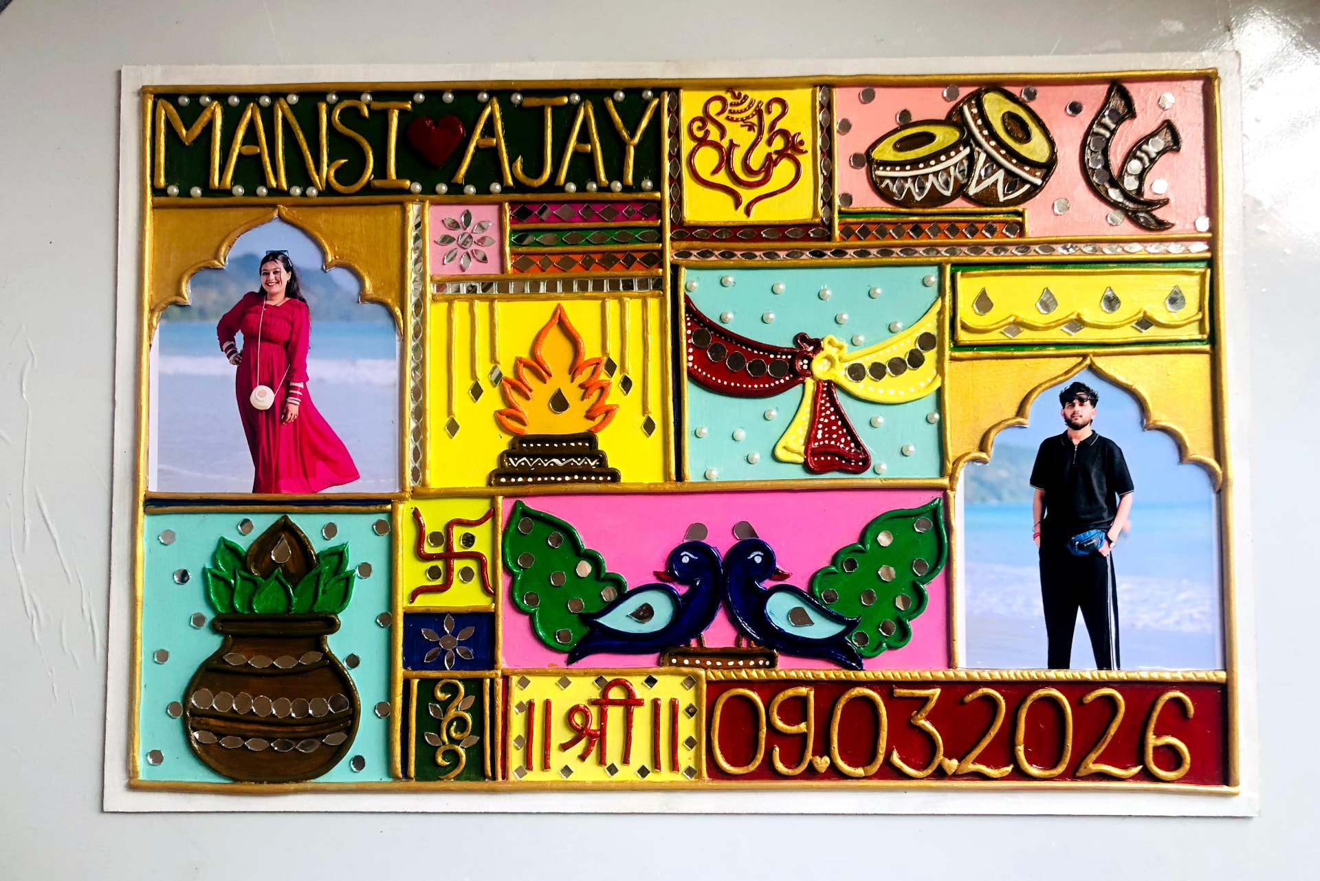 Colorful handcrafted Lippan family name plaque with photographs, mirrors, and raised patterns